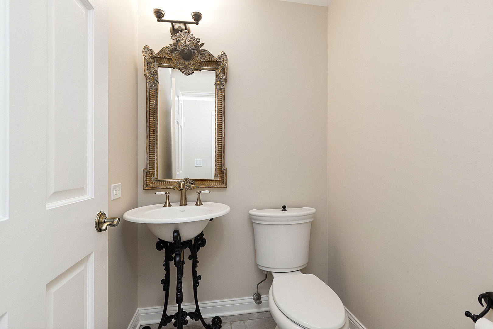 10534 Golf Road Orland Park, IL 60462 - Photo 19 of 54 a bathroom with a toilet sink and mirror