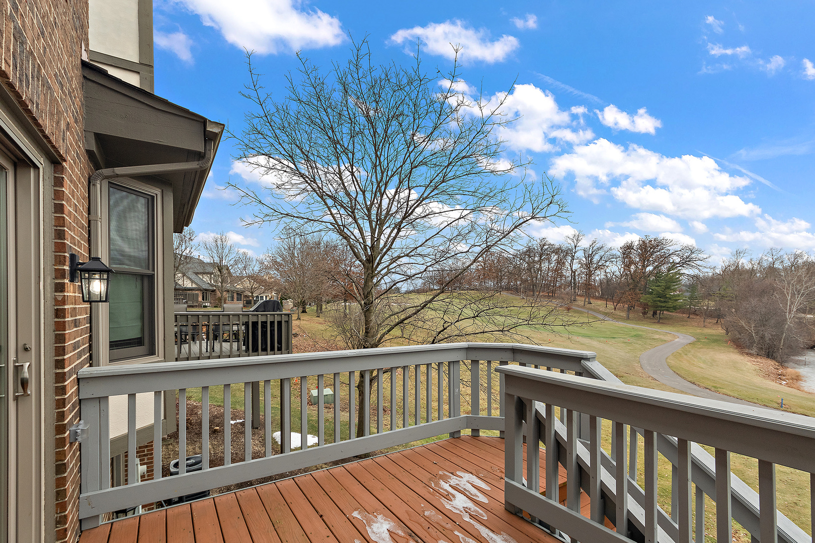 10534 Golf Road Orland Park, IL 60462 - Photo 28 of 54 a view of a balcony with wooden floor and fence