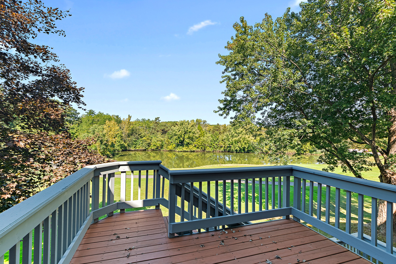 10534 Golf Road Orland Park, IL 60462 - Photo 34 of 54 a balcony with wooden floor and fence