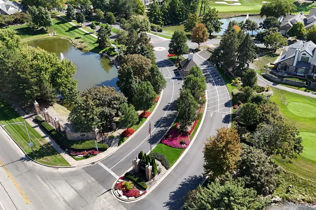 an aerial view of residential house with outdoor space and lake view