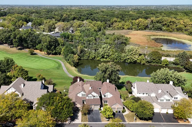 an aerial view of lake residential houses with outdoor space and river