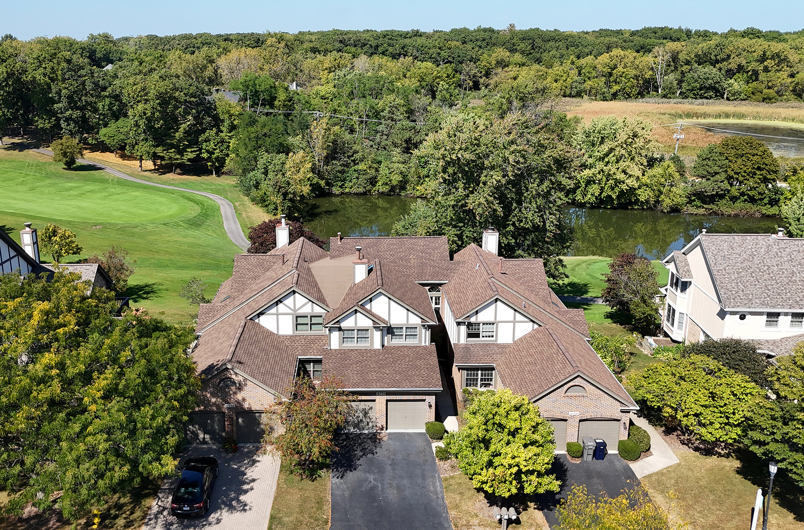 10534 Golf Road Orland Park, IL 60462 - Photo 51 of 54 an aerial view of a house with a garden and lake view
