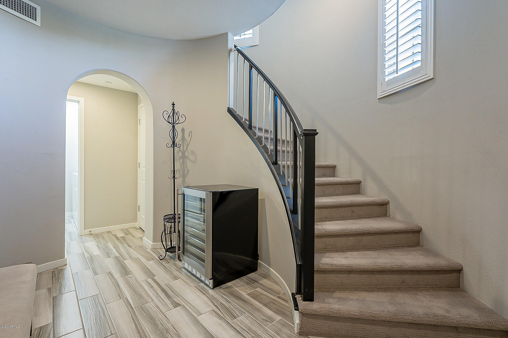 3935 East Rough Rider Road, Unit 1337 Phoenix, AZ 85050 - Photo 12 of 57 a view of entryway and hall with wooden floor