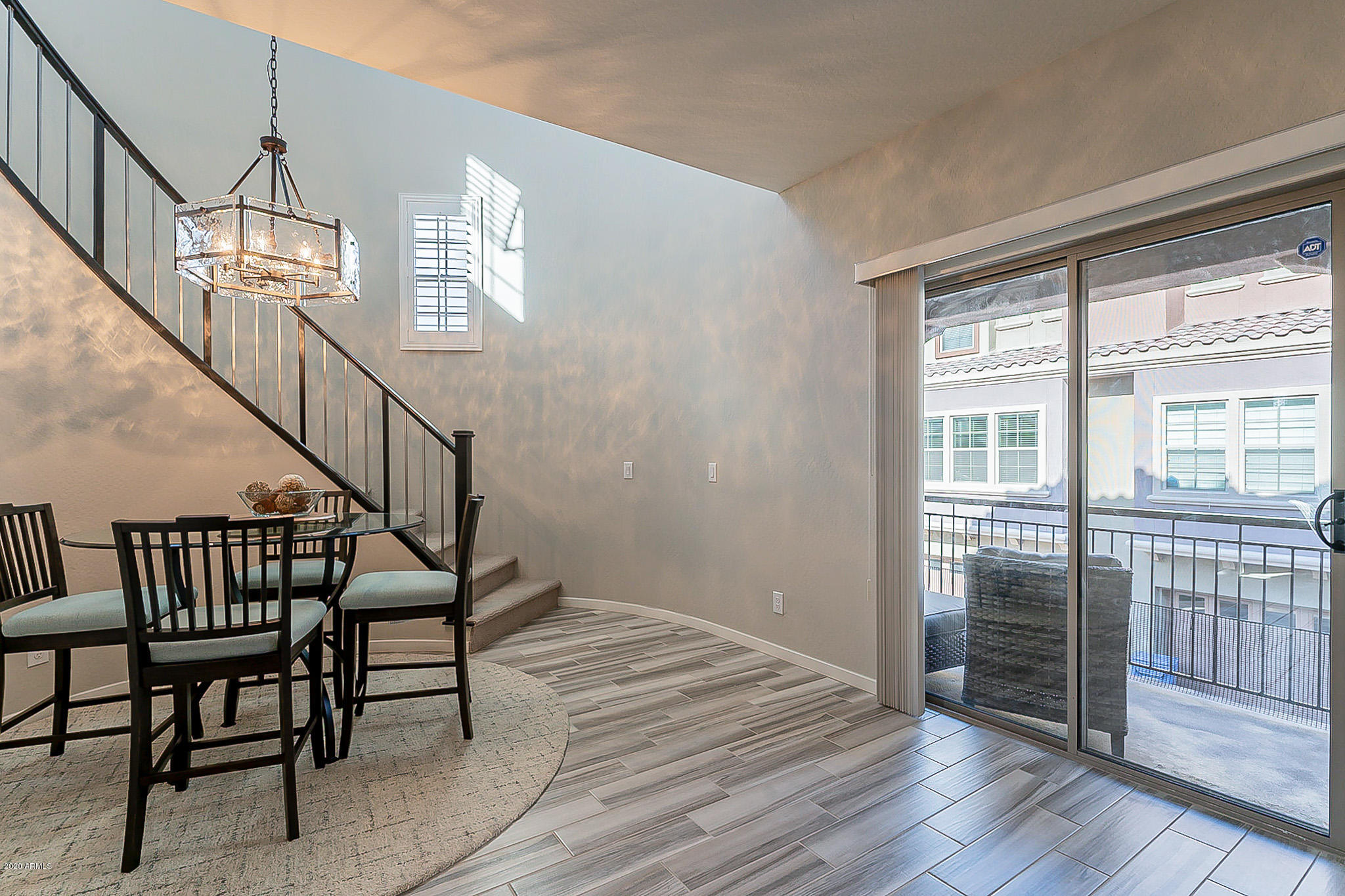 3935 East Rough Rider Road, Unit 1337 Phoenix, AZ 85050 - Photo 23 of 57 a view of entryway and hall with wooden floor