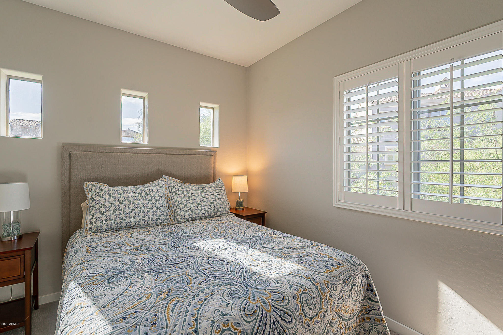 3935 East Rough Rider Road, Unit 1337 Phoenix, AZ 85050 - Photo 26 of 57 a bedroom with a bed and window