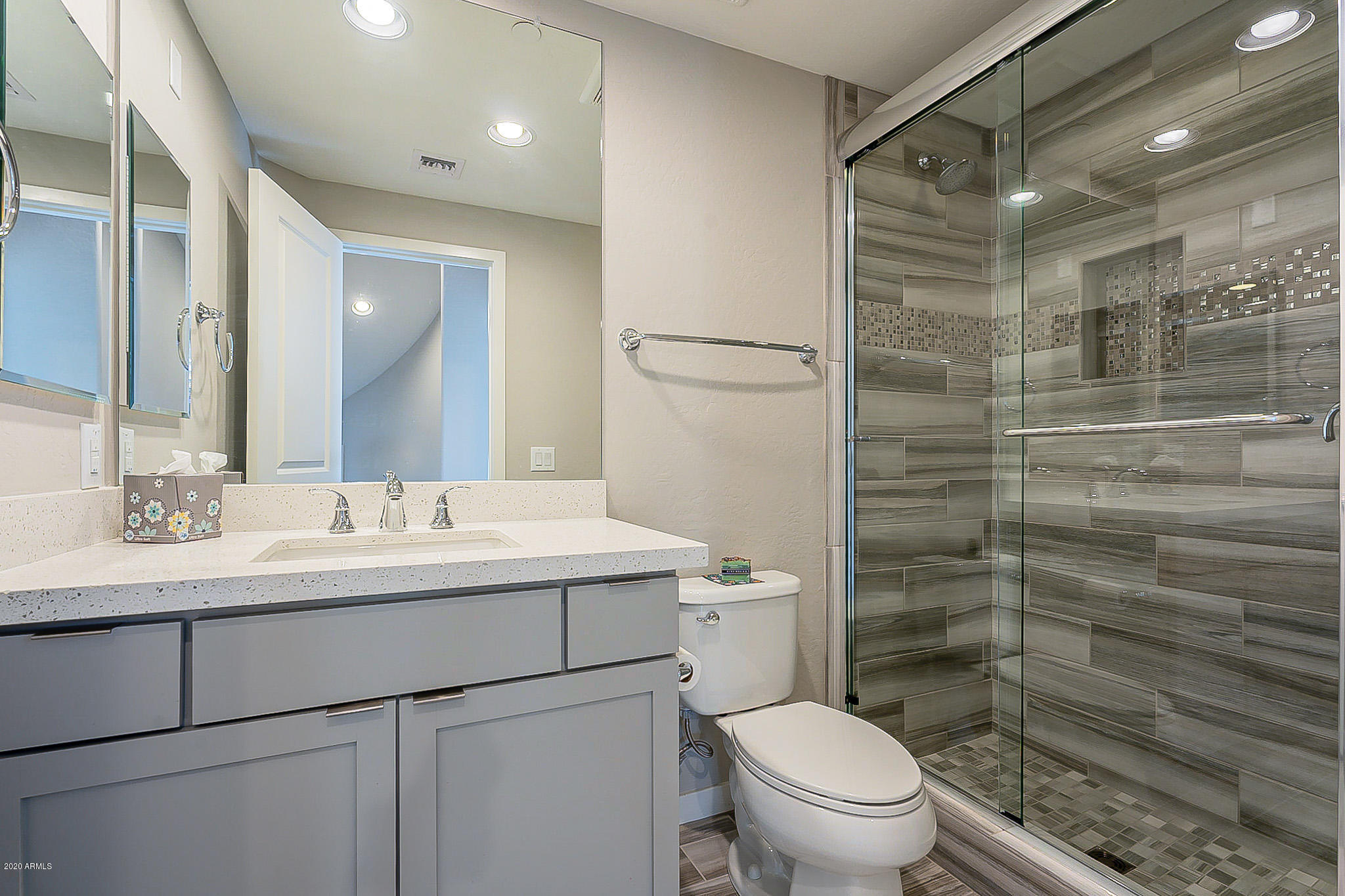 3935 East Rough Rider Road, Unit 1337 Phoenix, AZ 85050 - Photo 27 of 57 a bathroom with a sink toilet and shower