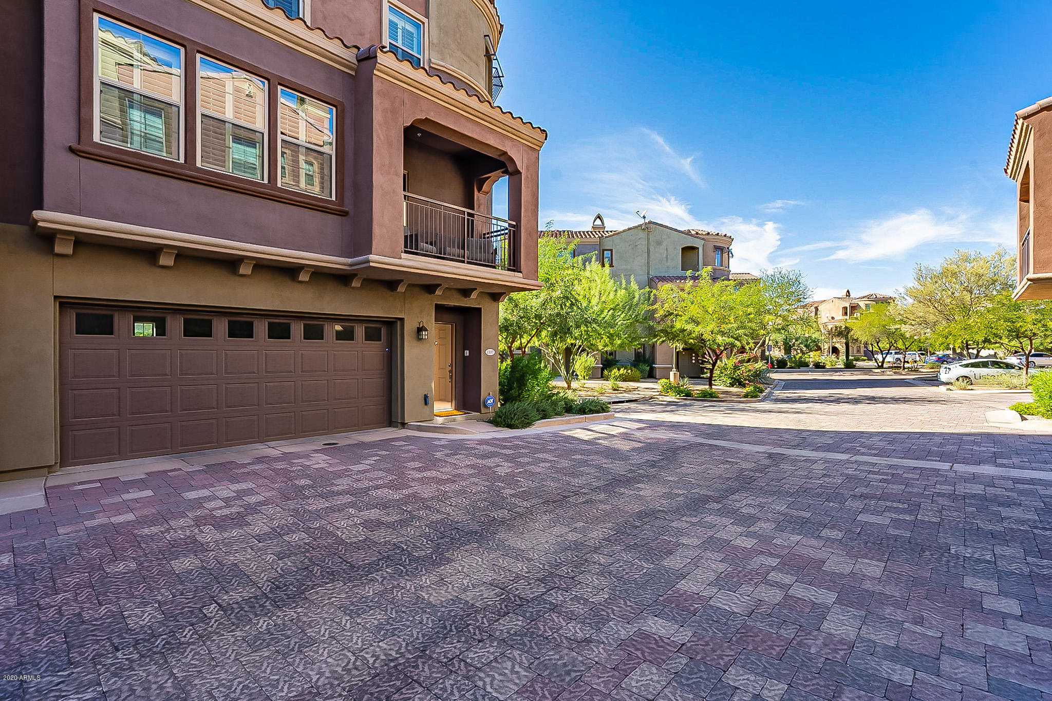 3935 East Rough Rider Road, Unit 1337 Phoenix, AZ 85050 - Photo 3 of 57 a view of a house with a yard and potted plants