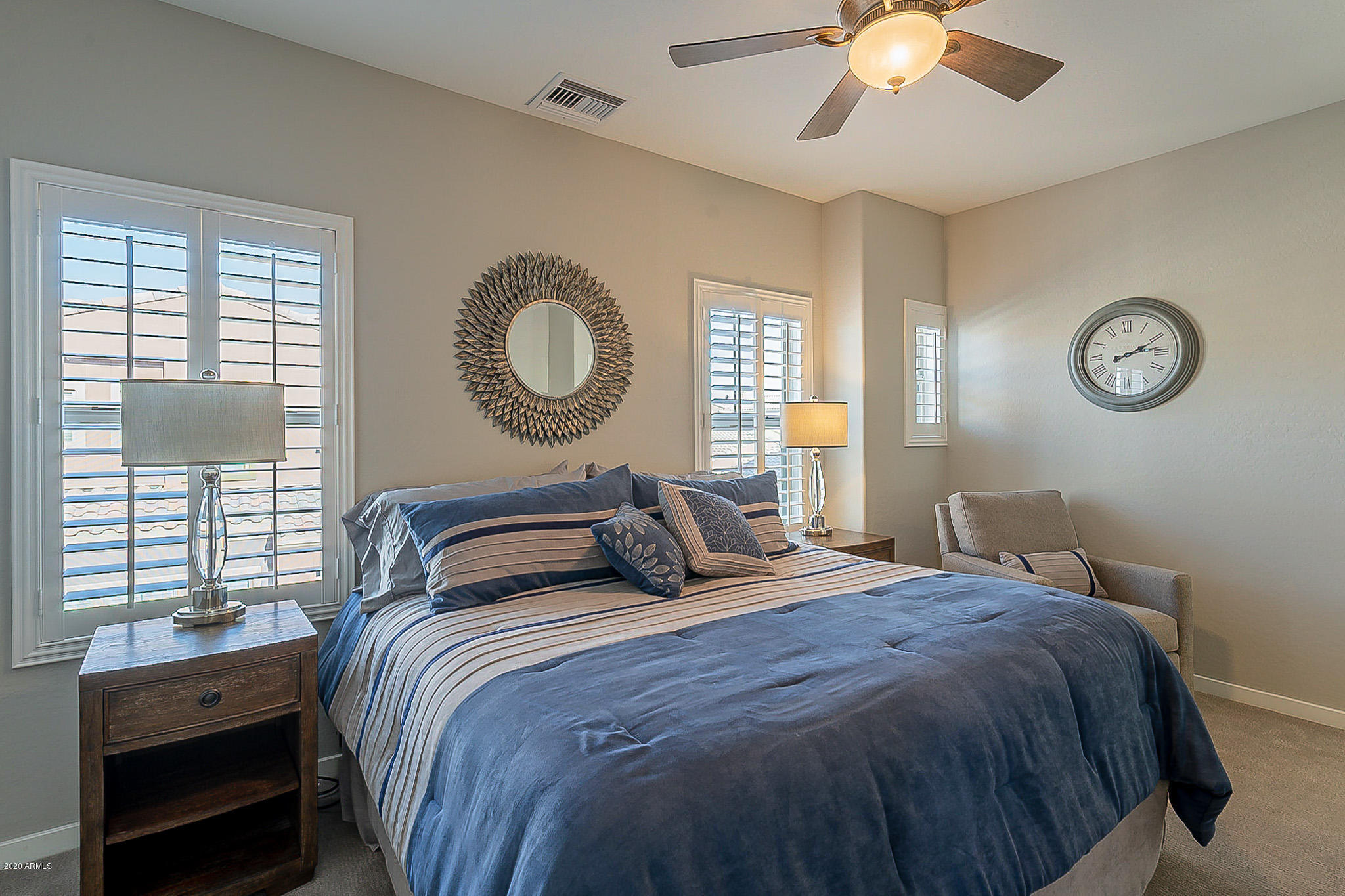 3935 East Rough Rider Road, Unit 1337 Phoenix, AZ 85050 - Photo 36 of 57 a bedroom with a bed and a window