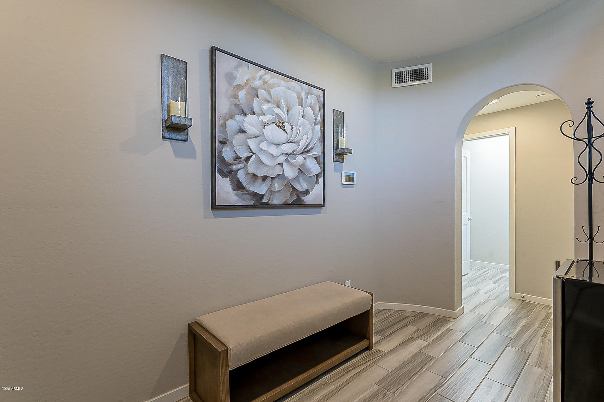 3935 East Rough Rider Road, Unit 1337 Phoenix, AZ 85050 - Photo 7 of 57 a view of room with window and wooden floor