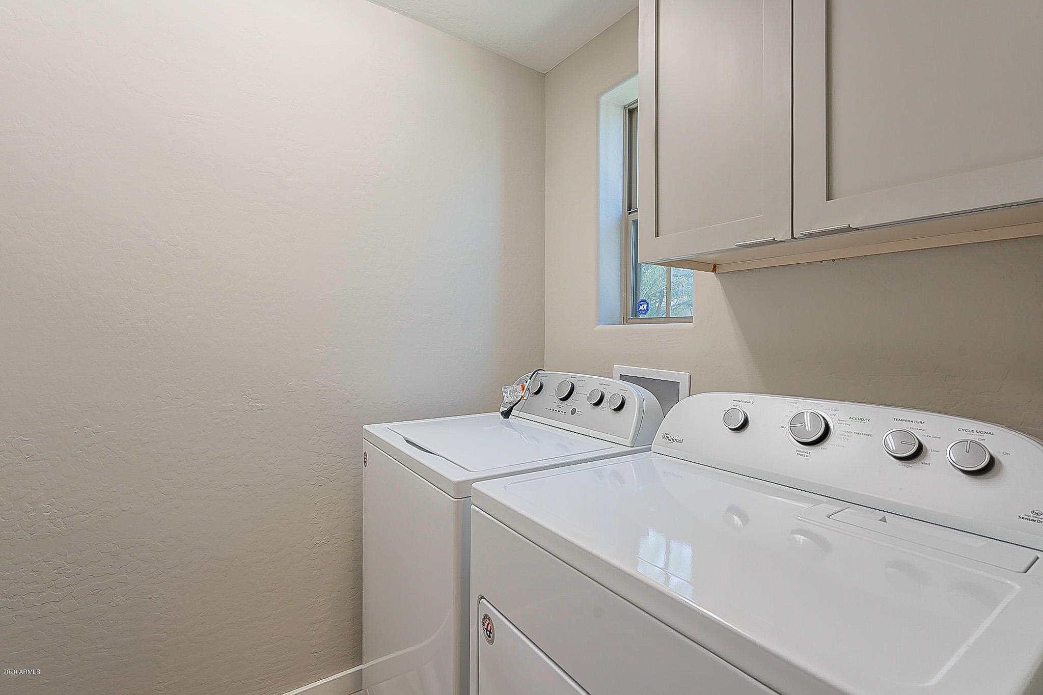 3935 East Rough Rider Road, Unit 1337 Phoenix, AZ 85050 - Photo 8 of 57 a utility room with dryer and washer