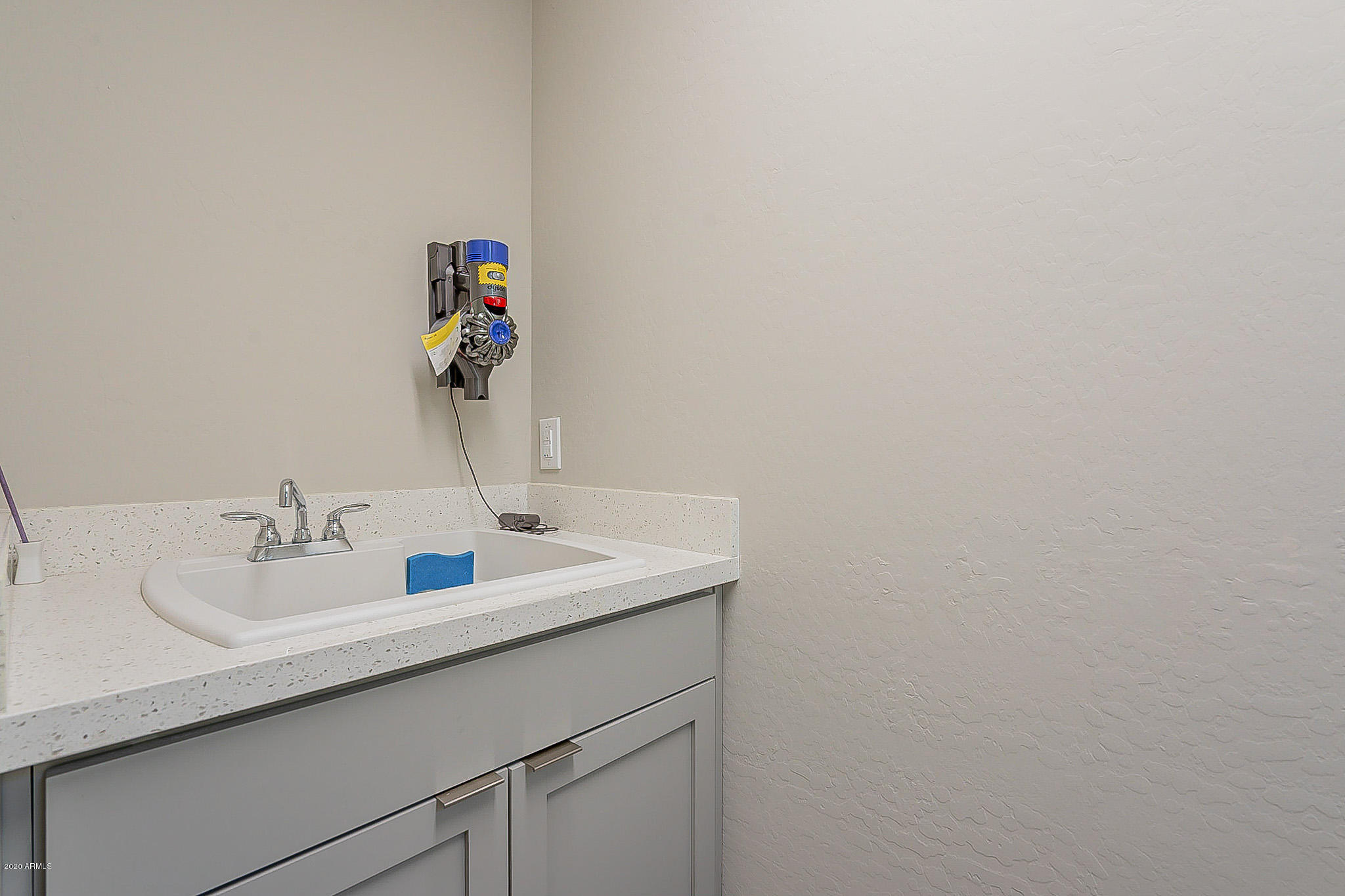 3935 East Rough Rider Road, Unit 1337 Phoenix, AZ 85050 - Photo 9 of 57 a bathroom with a sink and a mirror