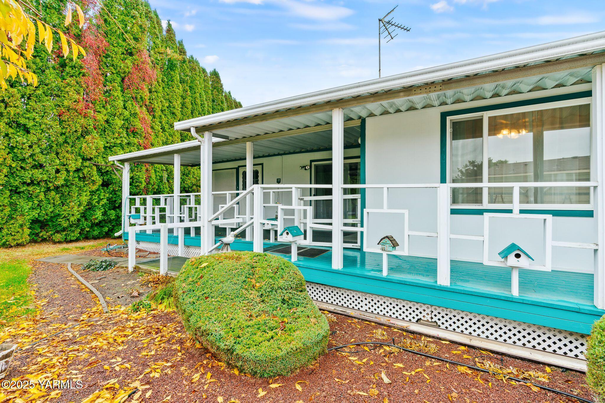 3701 Gun Club Road, Unit 43 Yakima, WA 98901 - Photo 26 of 29 a view of a house with a backyard porch and sitting area
