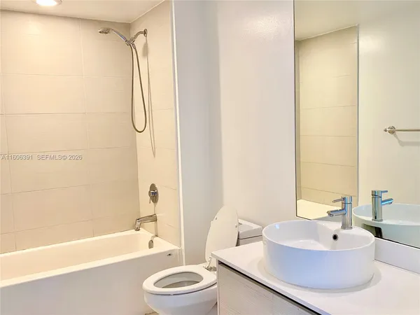 a bathroom with a sink a toilet and a bathtub