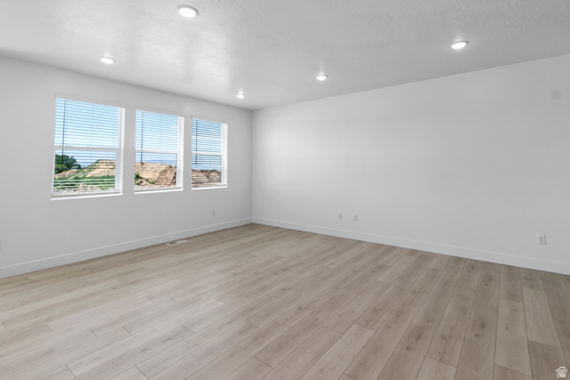 2816 West Aurora Avenue Mapleton, UT 84664 - Photo 4 of 20 Unfurnished room with light wood-type flooring and recessed lighting
