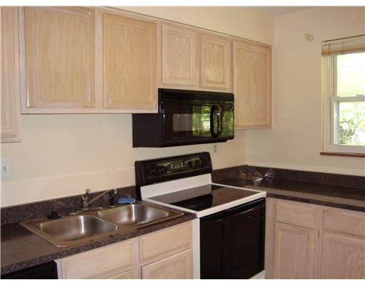 111 Conewanta Road Upper St. Clair, PA 15241 - Photo 8 of 18 Kitchen. Fully-equipped Kitchen offers neutral cabinets, double sink, electric stove, and built-in microwave. Window view of backyard!