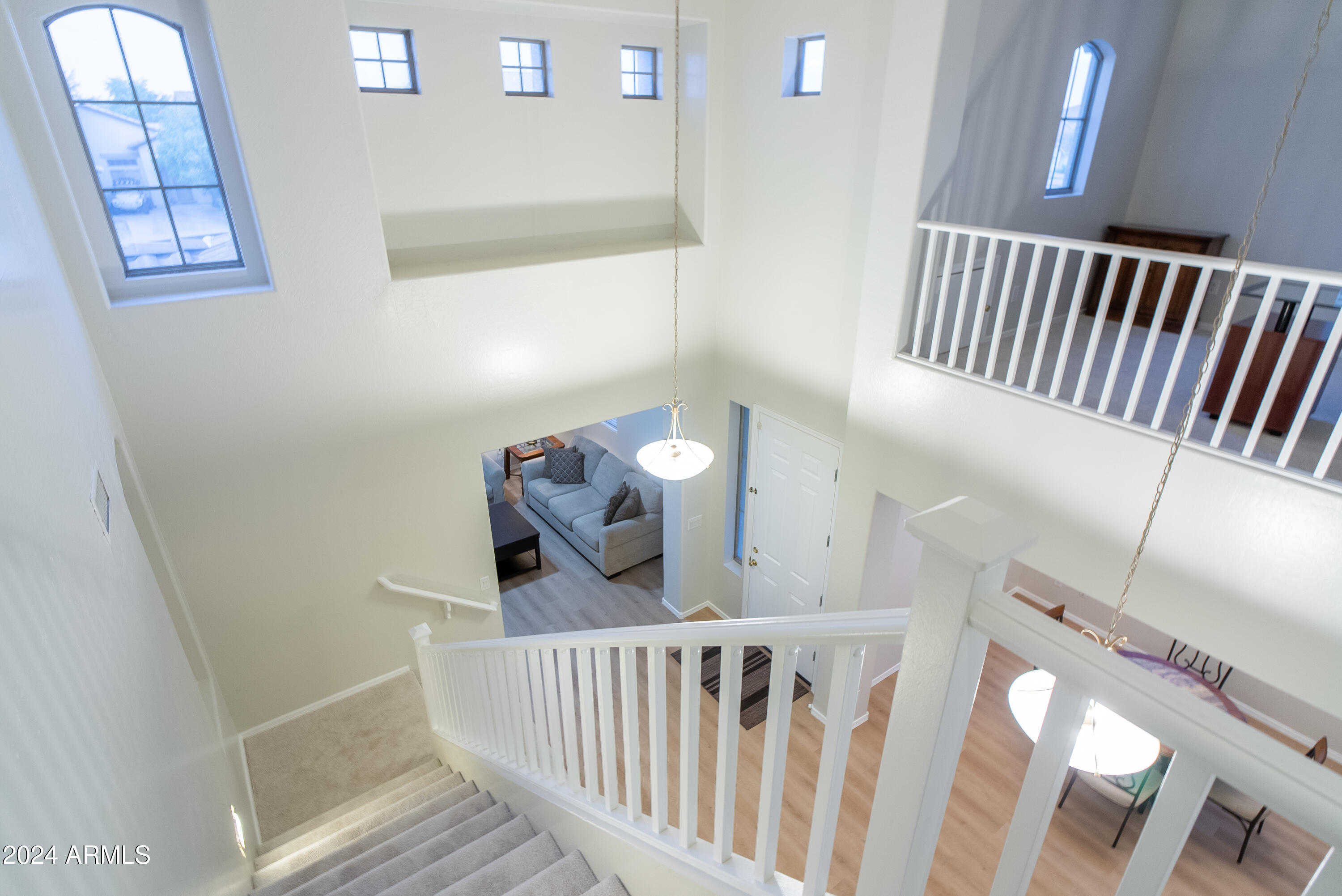 15471 West Statler Circle Surprise, AZ 85374 - Photo 21 of 32 a view of staircase with railing and white walls