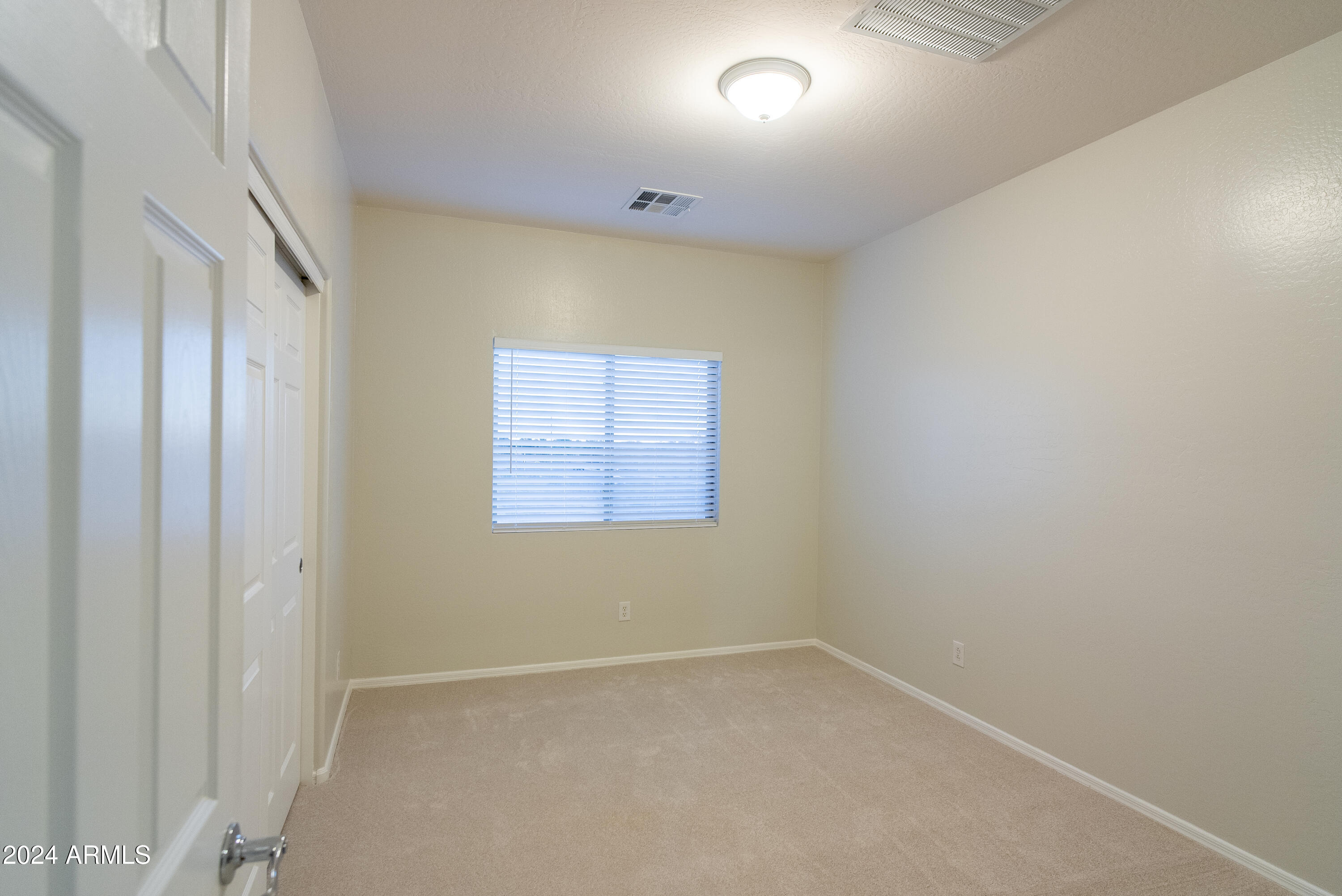 15471 West Statler Circle Surprise, AZ 85374 - Photo 25 of 32 an empty room with a window