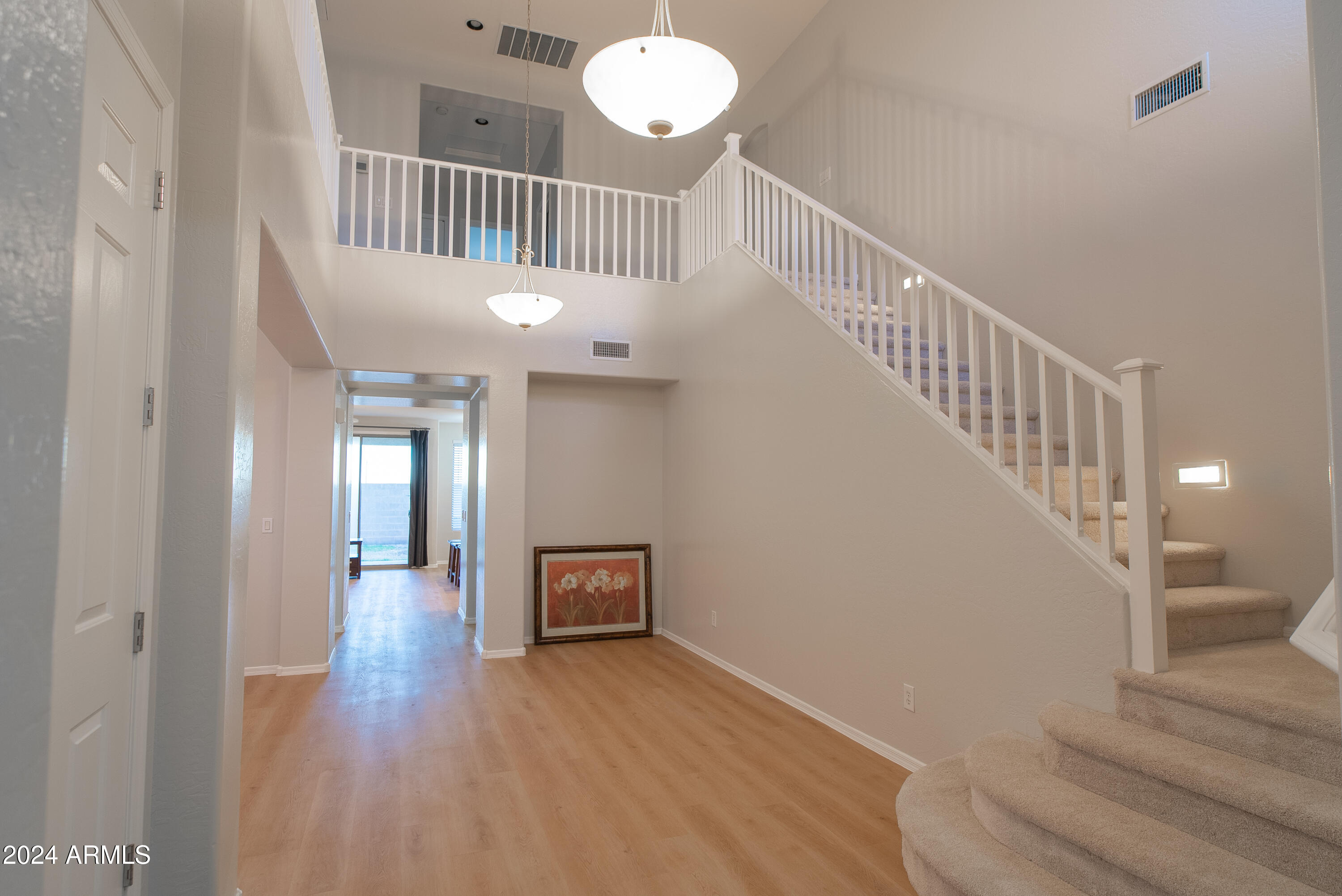 15471 West Statler Circle Surprise, AZ 85374 - Photo 3 of 32 a view of entryway and hall with wooden floor