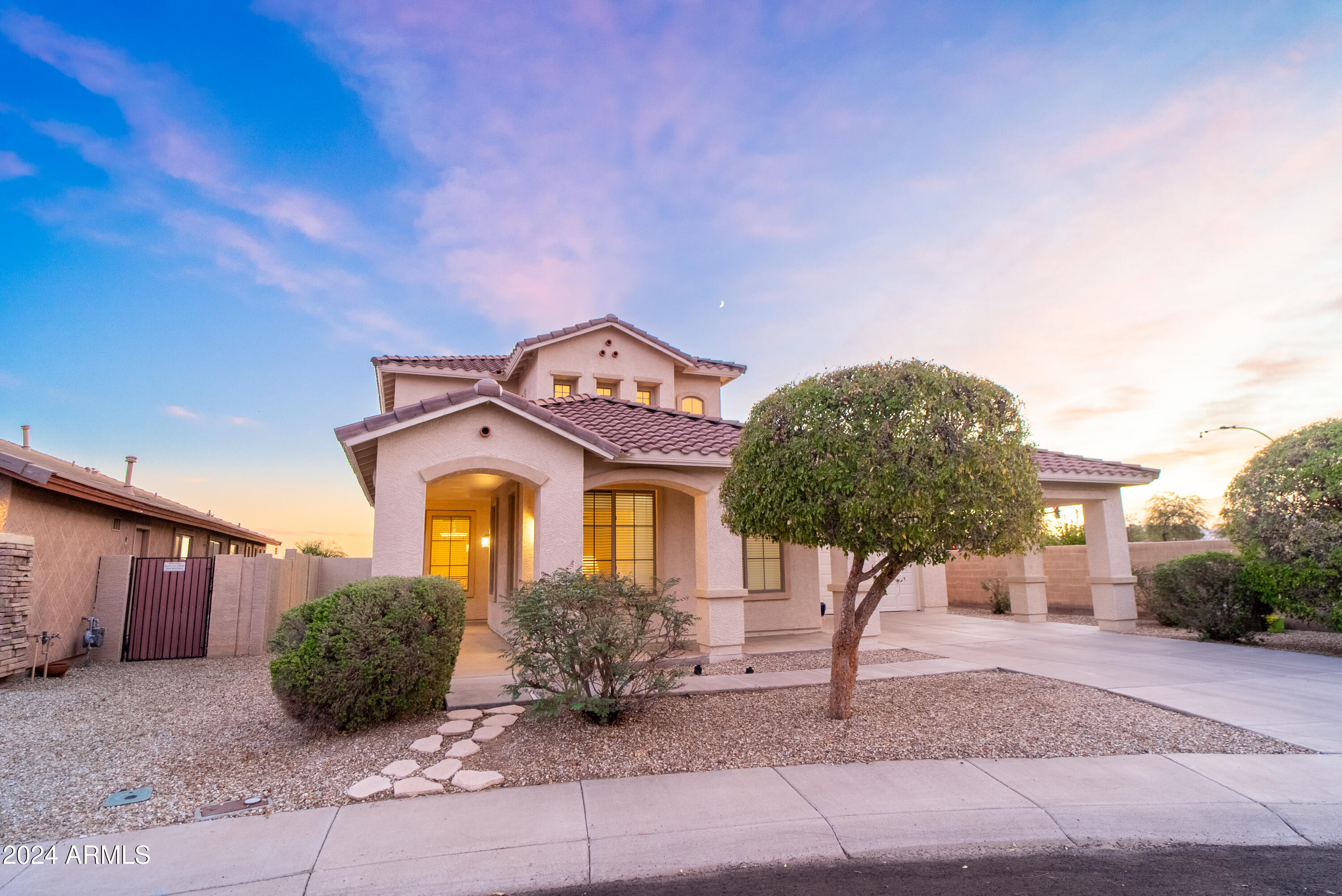 15471 West Statler Circle Surprise, AZ 85374 - Photo 31 of 32 a front view of a house with garden