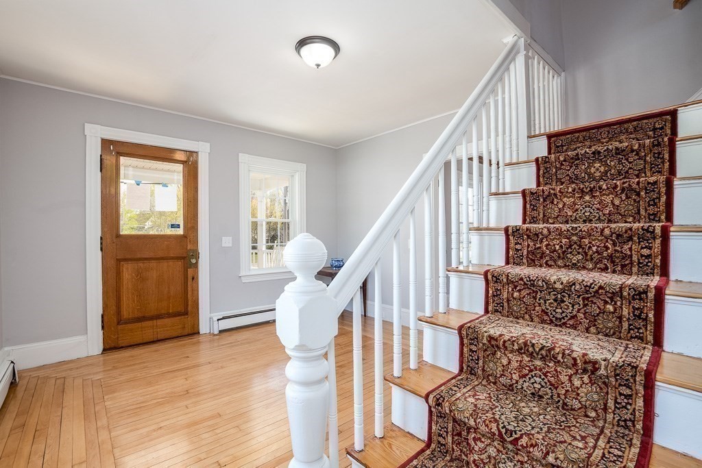 570 Canton Street Stoughton, MA 02072 - Photo 17 of 41 a view of entryway with wooden floor