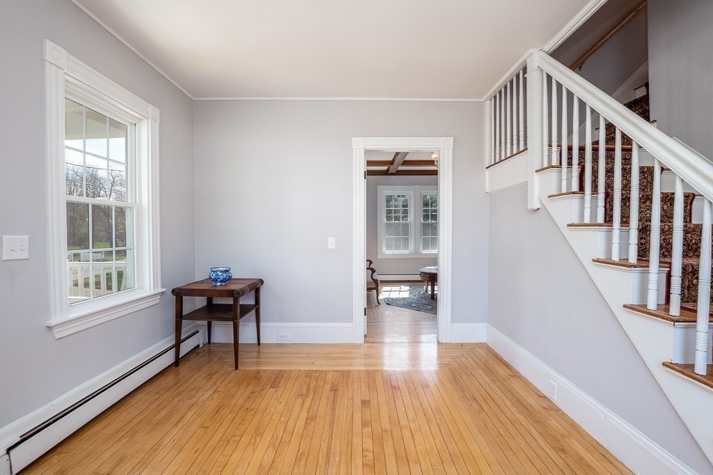570 Canton Street Stoughton, MA 02072 - Photo 18 of 41 a view of a livingroom with wooden floor and furniture