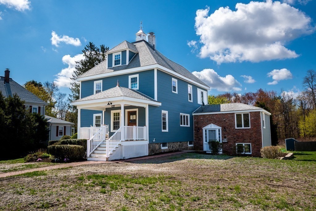 570 Canton Street Stoughton, MA 02072 - Photo 2 of 41 a front view of a house with a yard