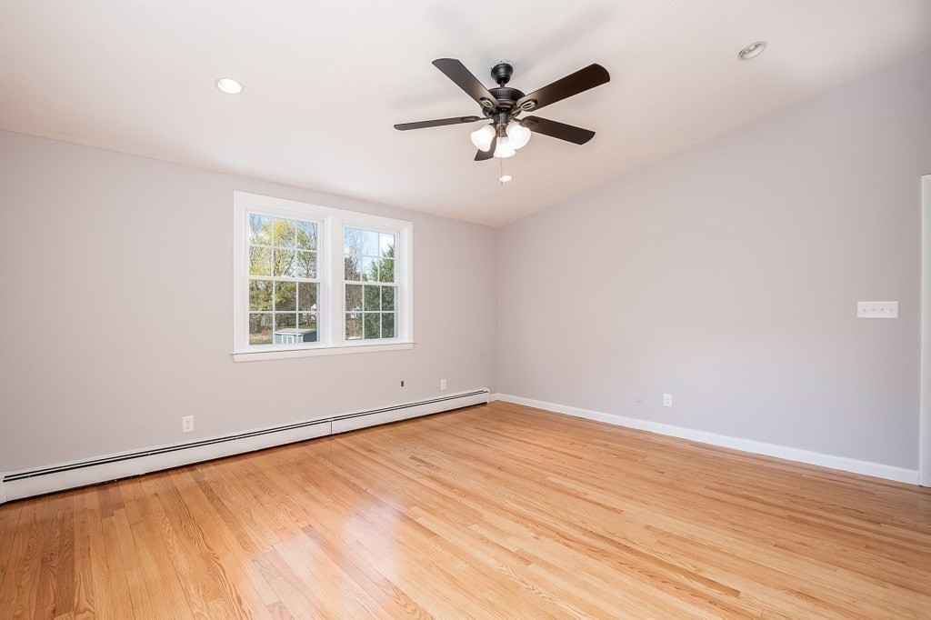 570 Canton Street Stoughton, MA 02072 - Photo 26 of 41 an empty room with wooden floor fan and windows