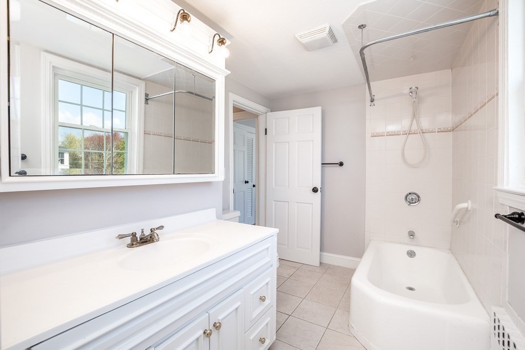 570 Canton Street Stoughton, MA 02072 - Photo 27 of 41 a bathroom with a bathtub and a sink
