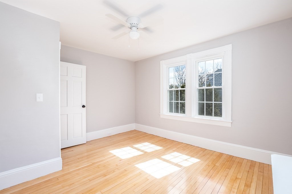 570 Canton Street Stoughton, MA 02072 - Photo 34 of 41 an empty room with wooden floor closet and windows
