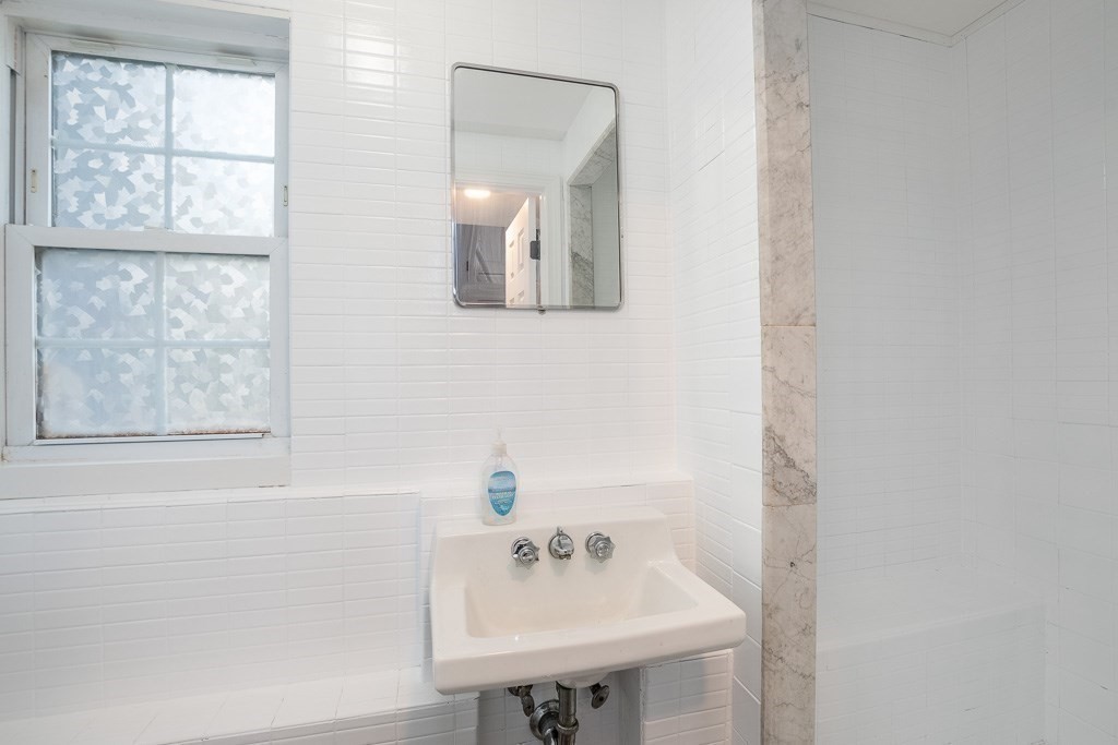 570 Canton Street Stoughton, MA 02072 - Photo 36 of 41 a bathroom with a sink and a mirror