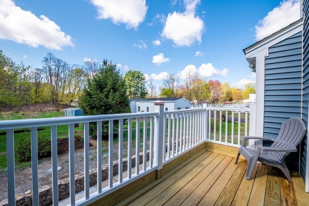 570 Canton Street Stoughton, MA 02072 - Photo 7 of 41 a view of a two chairs on the roof deck