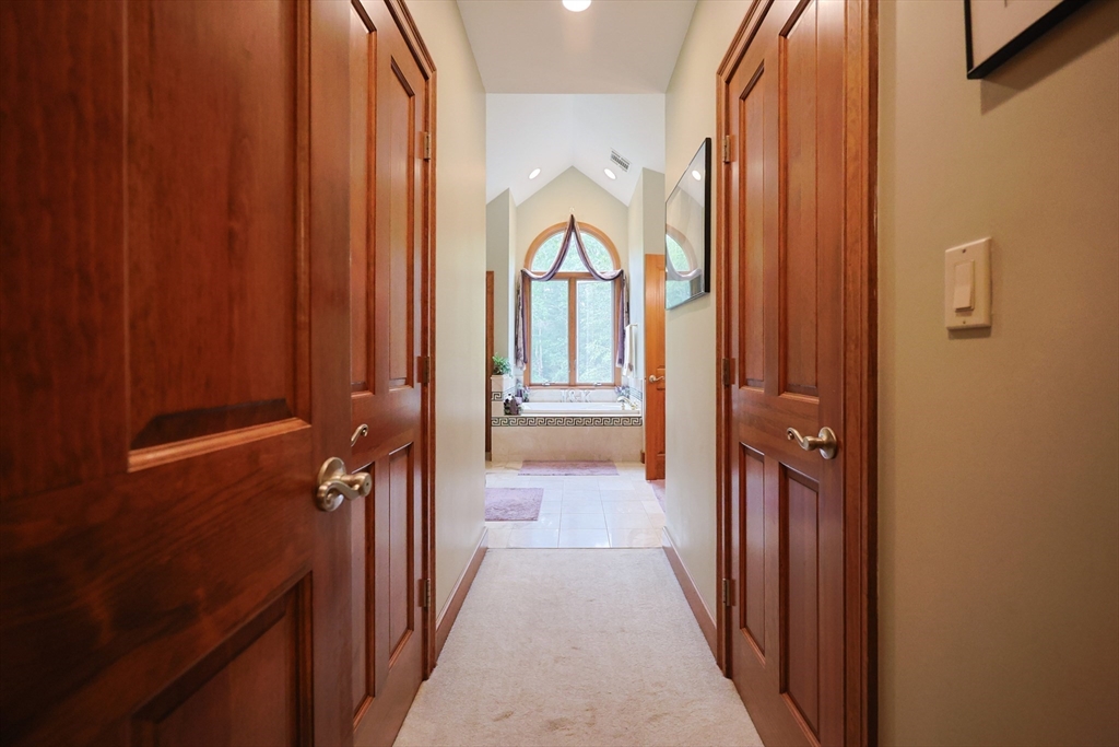 70 Azalea Way Hanson, MA 02341 - Photo 27 of 42 a view of a hallway with a elevator