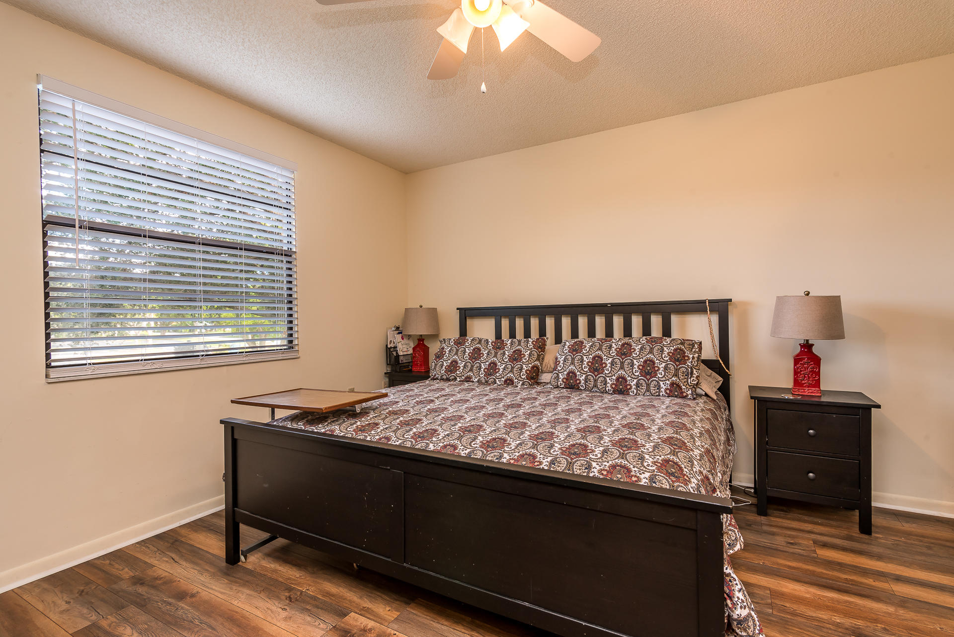6109 Balboa Circle, Unit 206 Boca Raton, FL 33433 - Photo 13 of 18 a bed sitting in a bedroom next to a window