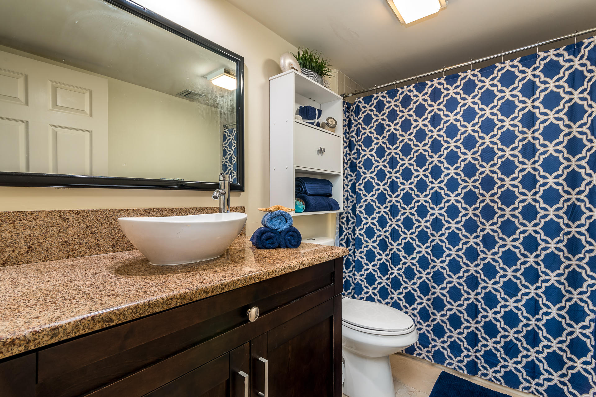 6109 Balboa Circle, Unit 206 Boca Raton, FL 33433 - Photo 17 of 18 a bathroom with a granite countertop sink and a toilet