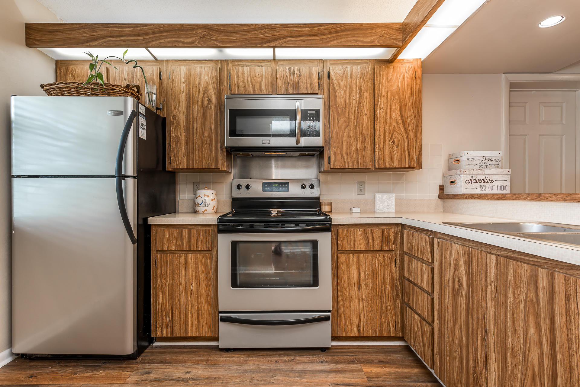 6109 Balboa Circle, Unit 206 Boca Raton, FL 33433 - Photo 6 of 18 a kitchen with stainless steel appliances a refrigerator and a sink