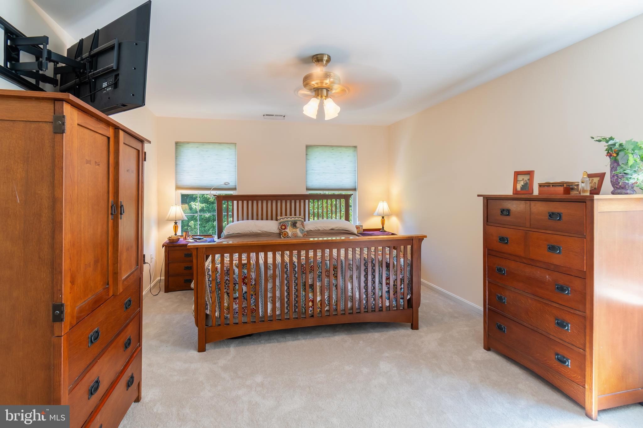 3040 Jones Road Dunkirk, MD 20754 - Photo 39 of 67 a bedroom with a bed and a chandelier