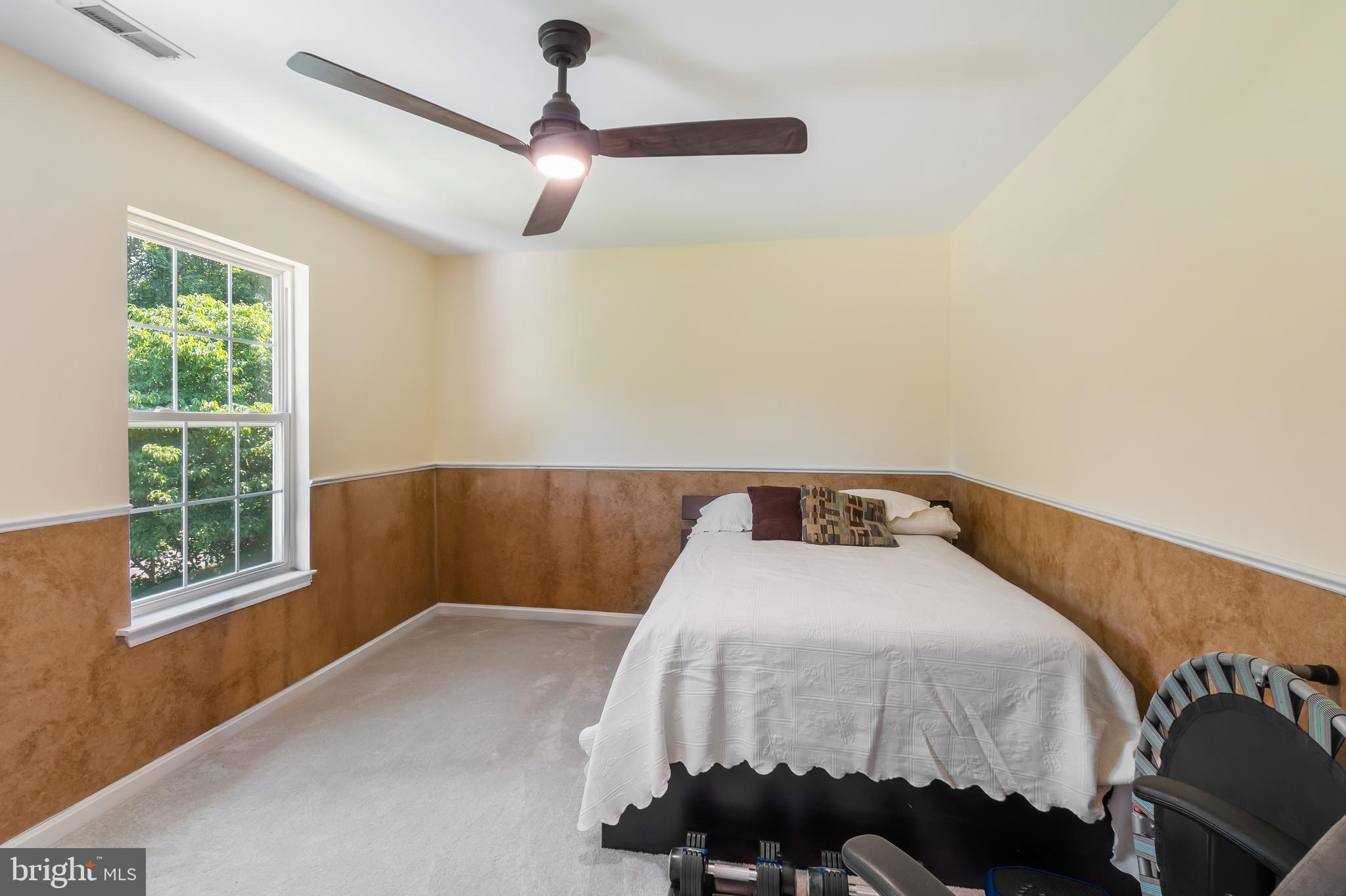 3040 Jones Road Dunkirk, MD 20754 - Photo 48 of 67 a bedroom with a bed and wooden floor