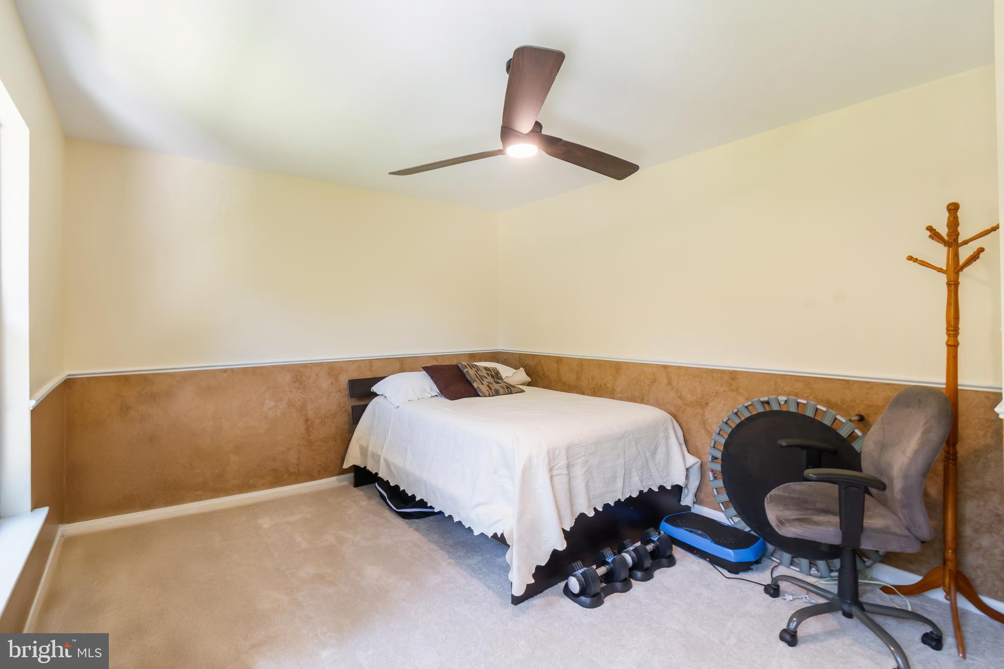 3040 Jones Road Dunkirk, MD 20754 - Photo 49 of 67 a bedroom with a bed and a chandelier