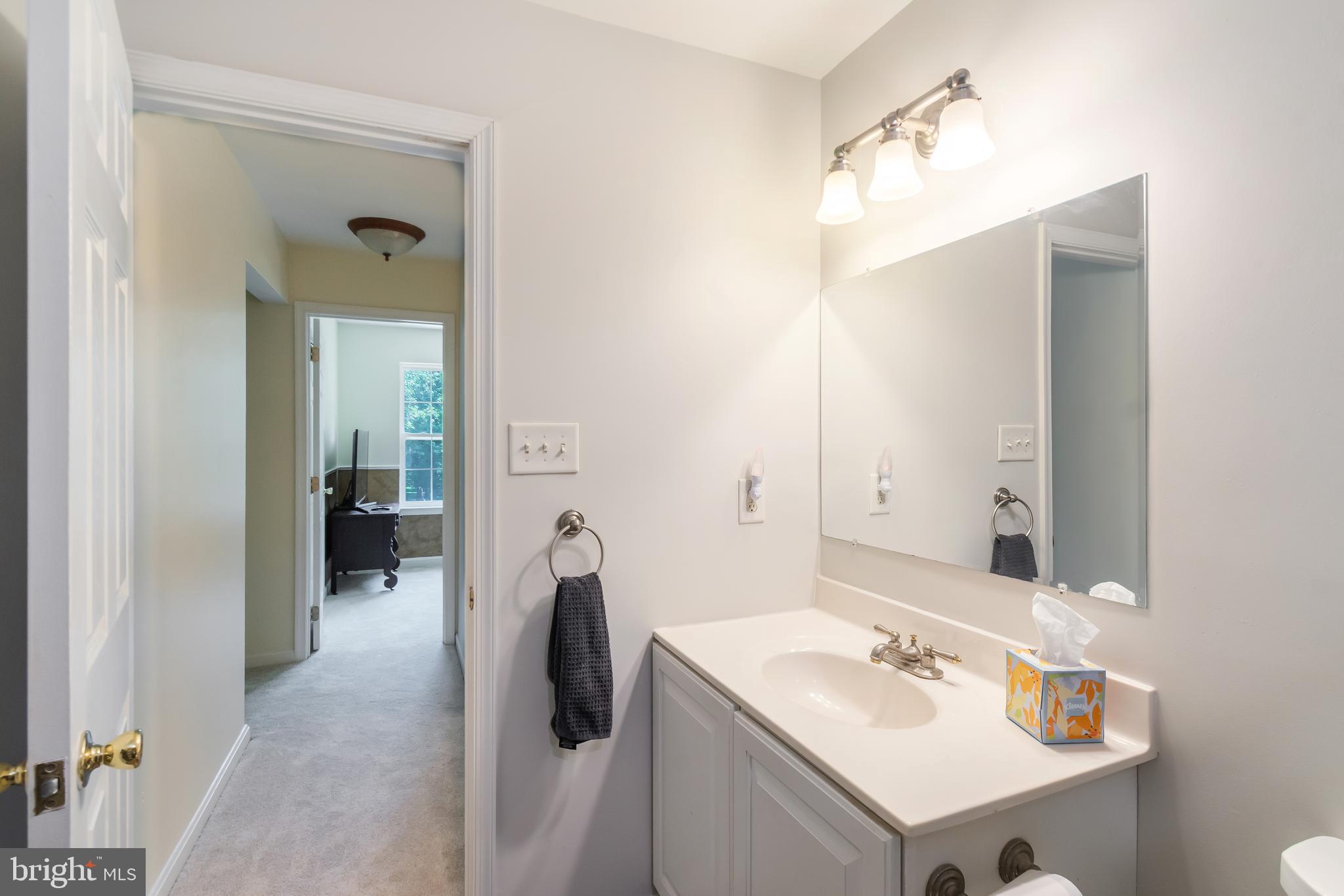 3040 Jones Road Dunkirk, MD 20754 - Photo 53 of 67 a bathroom with a sink vanity and mirror