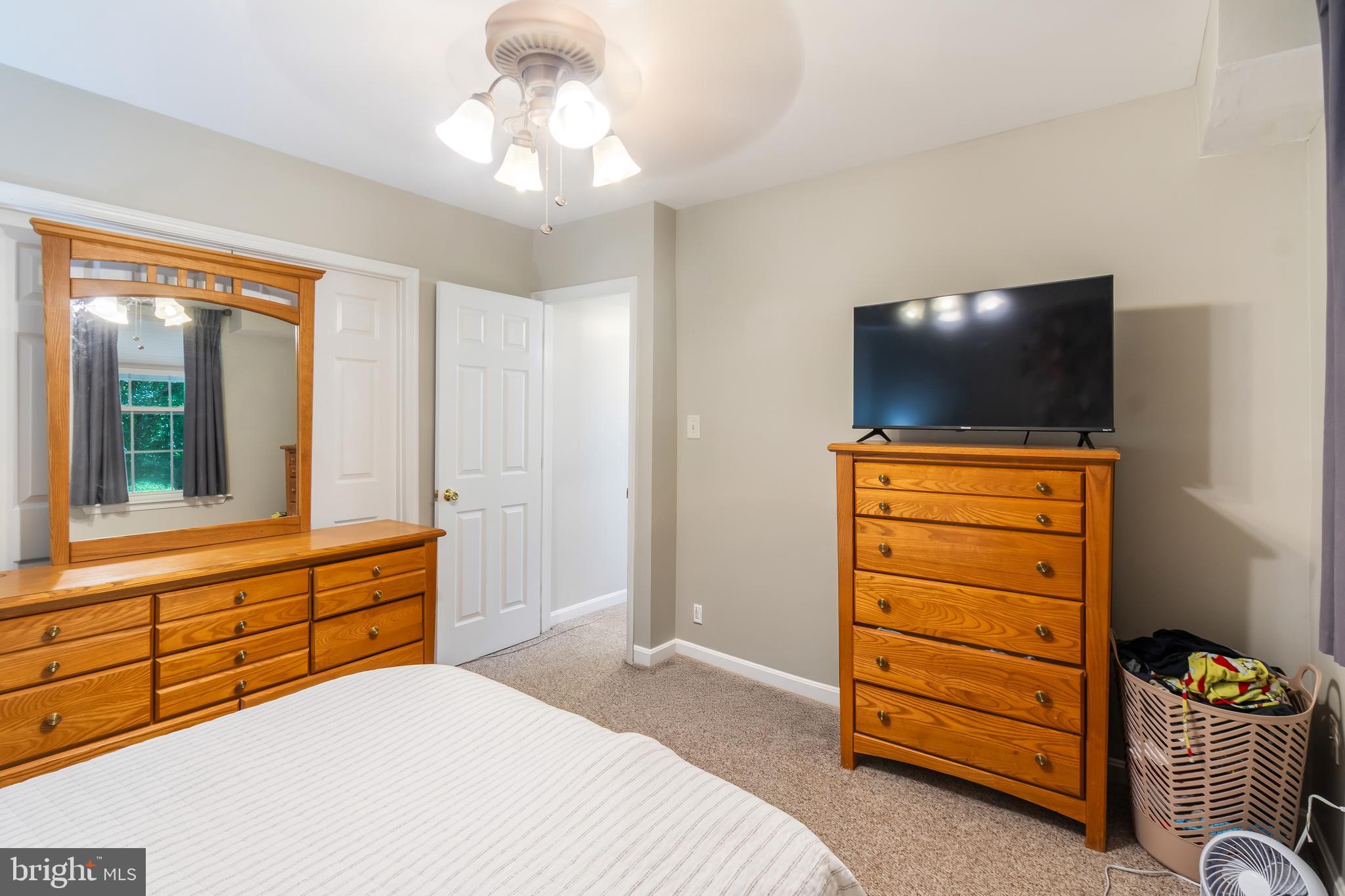 3040 Jones Road Dunkirk, MD 20754 - Photo 60 of 67 a bedroom with a bed and a flat screen tv