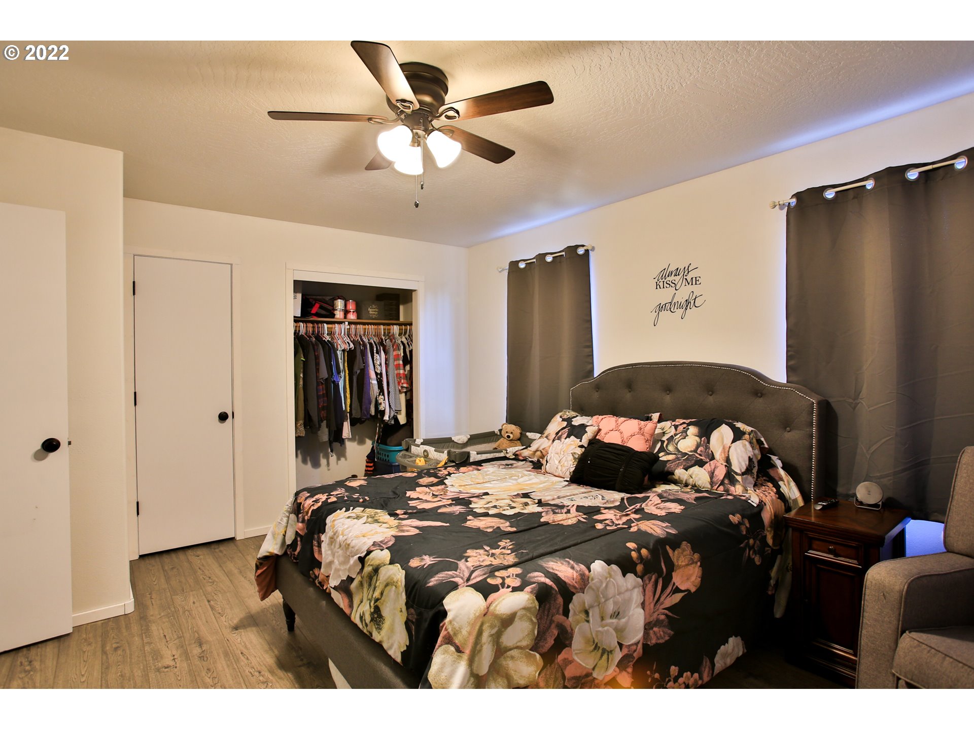 5520 E Street Springfield, OR 97478 - Photo 12 of 18 a bedroom with a bed and a walk in closet