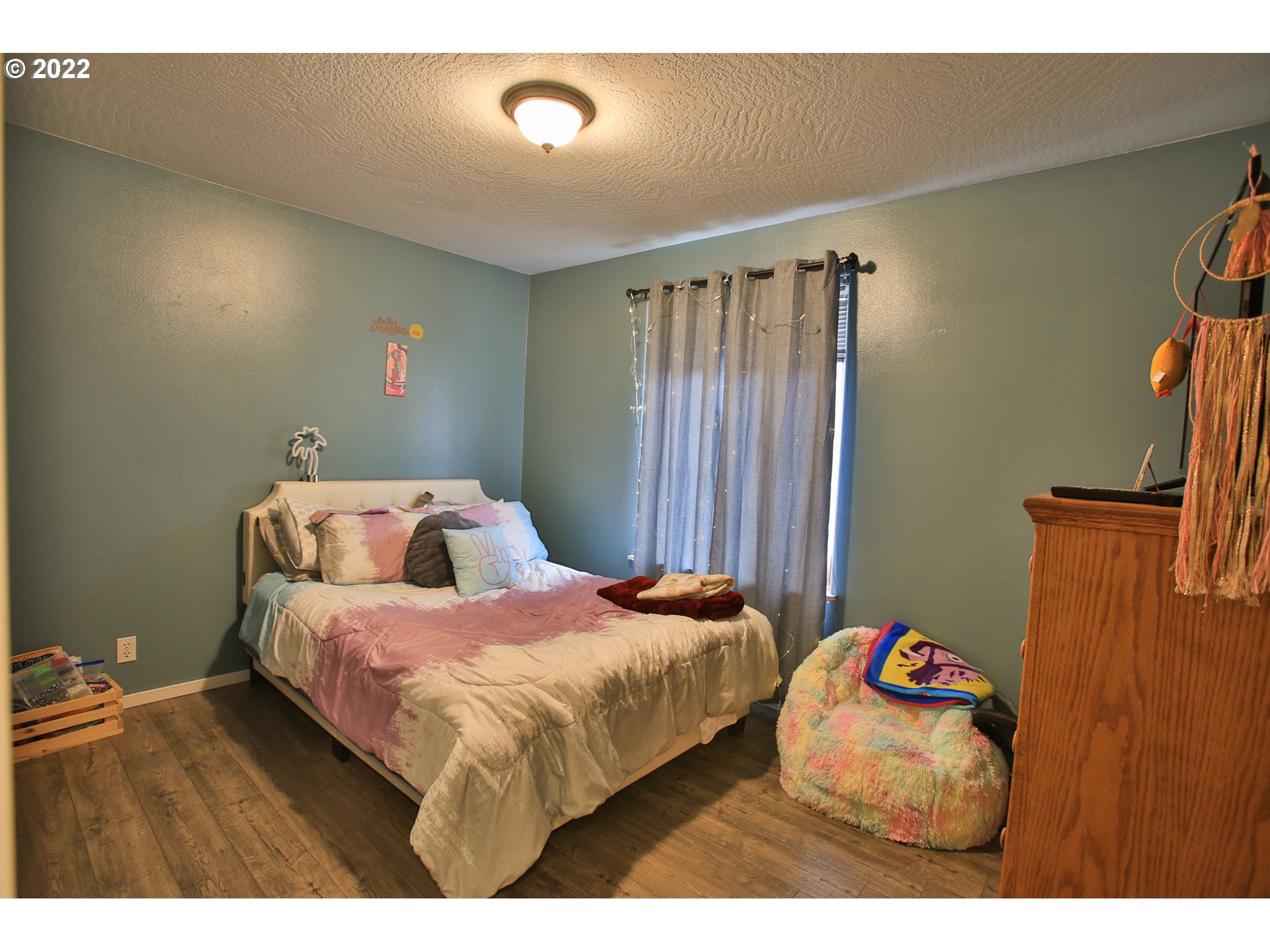 5520 E Street Springfield, OR 97478 - Photo 13 of 18 a bedroom with bed and window