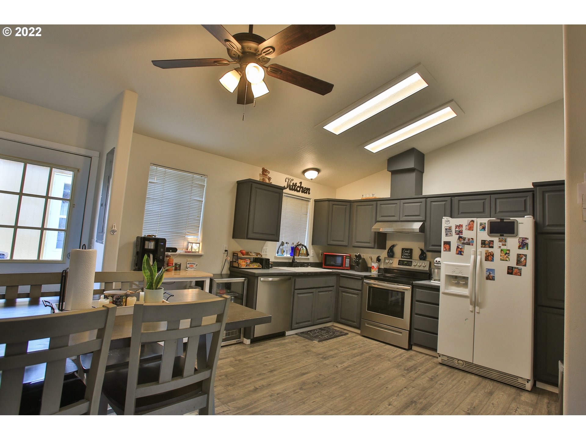 5520 E Street Springfield, OR 97478 - Photo 6 of 18 a kitchen with refrigerator and cabinets