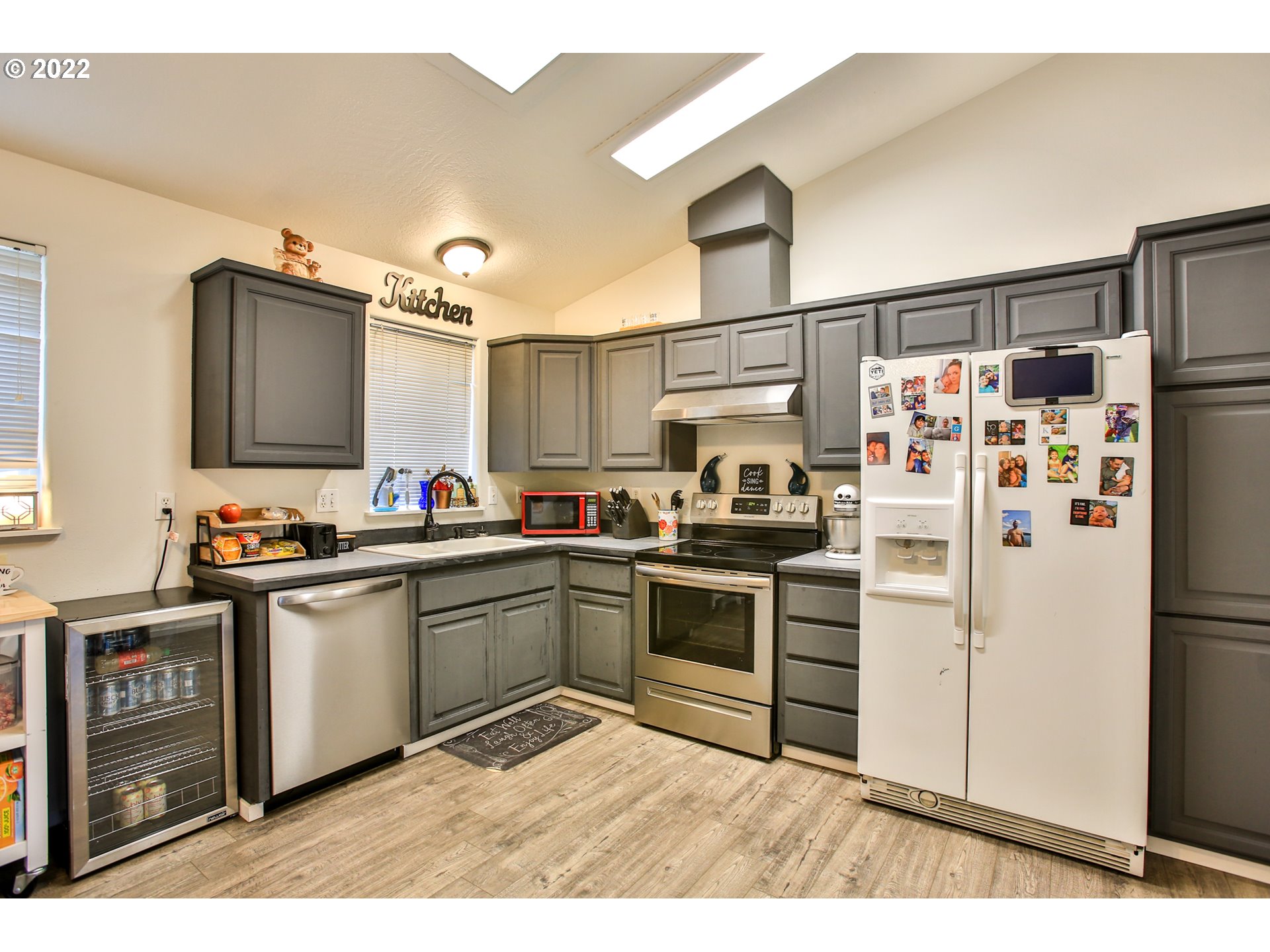 5520 E Street Springfield, OR 97478 - Photo 7 of 18 a kitchen with stainless steel appliances granite countertop a refrigerator sink and stove