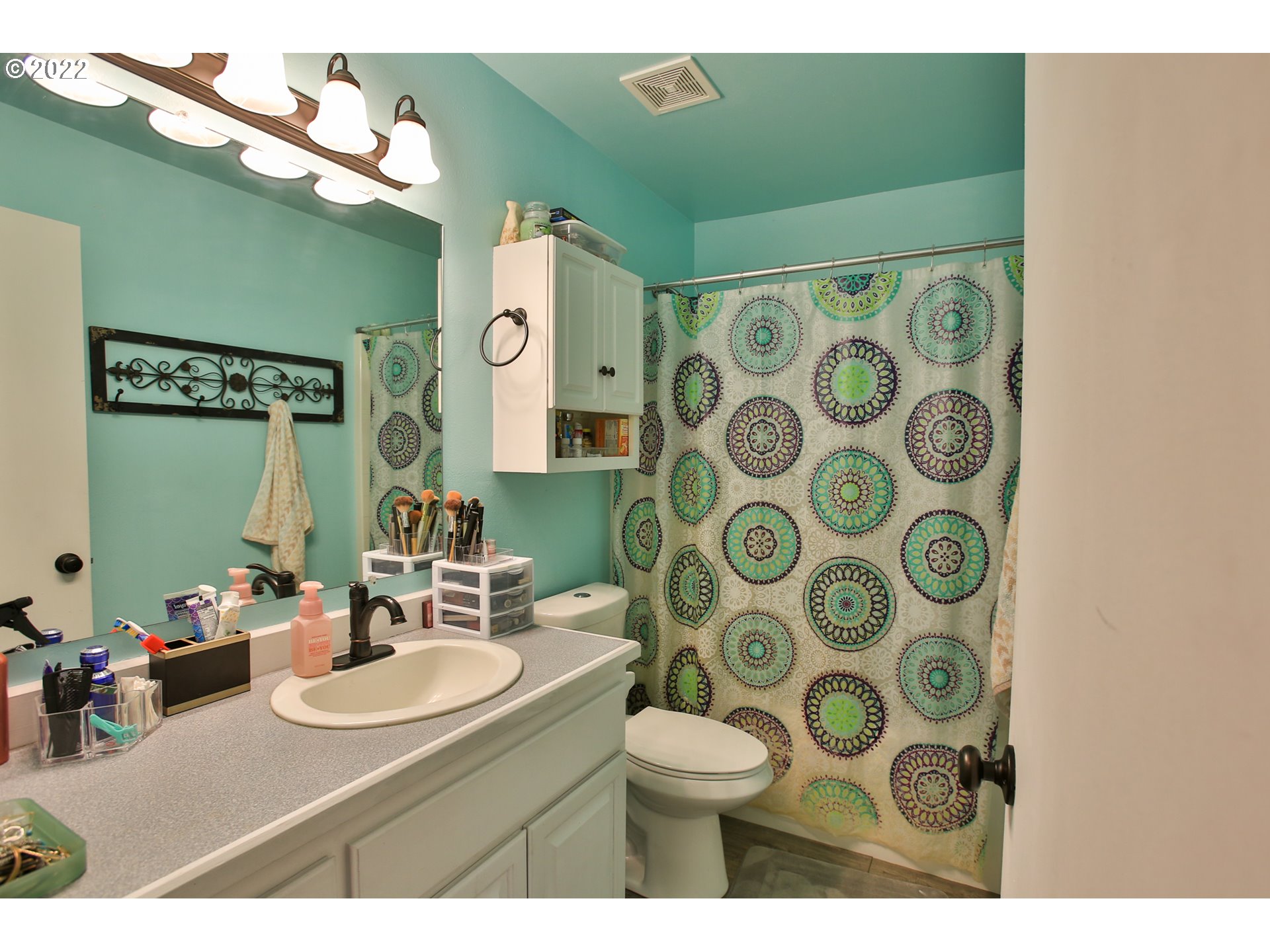5520 E Street Springfield, OR 97478 - Photo 10 of 18 a bathroom with a sink and a mirror