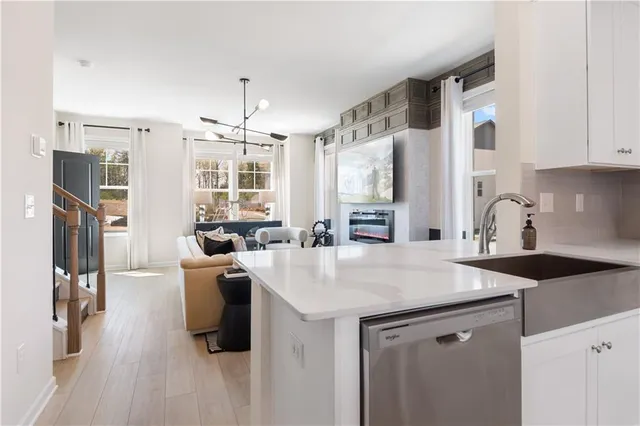 a view of kitchen with sink and breakfast area