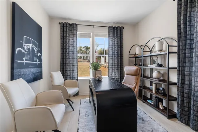 a kitchen with stainless steel appliances kitchen island granite countertop a table chairs sink and cabinets