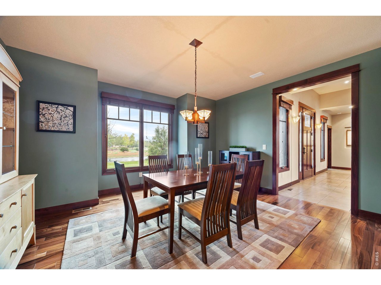 37127 Cullison Ridge Road Severance, CO 80550 - Photo 14 of 50 a dining room with furniture window and wooden floor