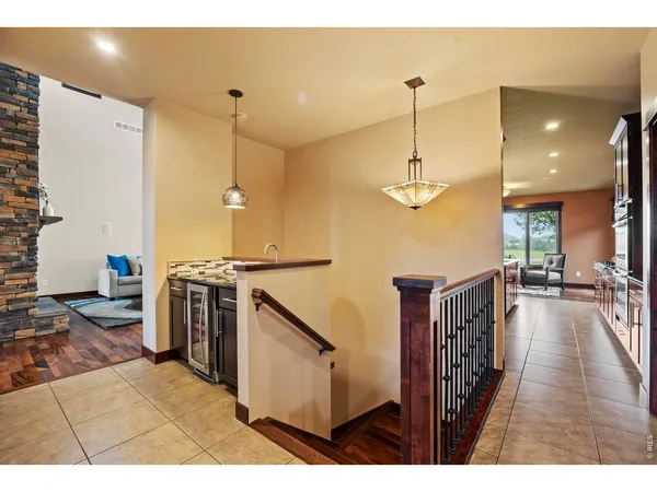 a open kitchen with stove and refrigerator