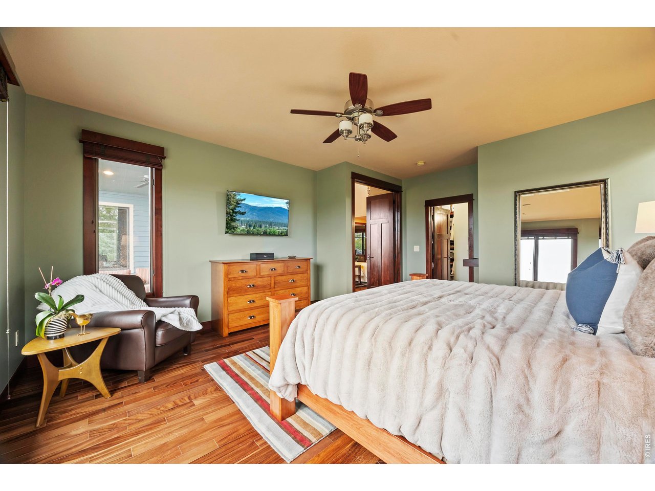 37127 Cullison Ridge Road Severance, CO 80550 - Photo 17 of 50 a bedroom with a bed and wooden floor